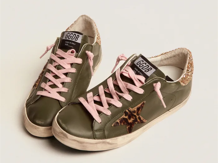 GOLDEN GOOSE Super-Star sneakers in dark green leather with gold glitter heel tab