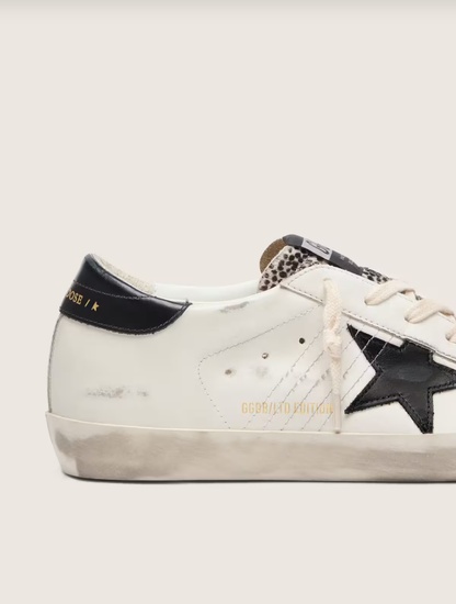 Golden Goose Super-Star LTD in white leather with black star and pony skin details